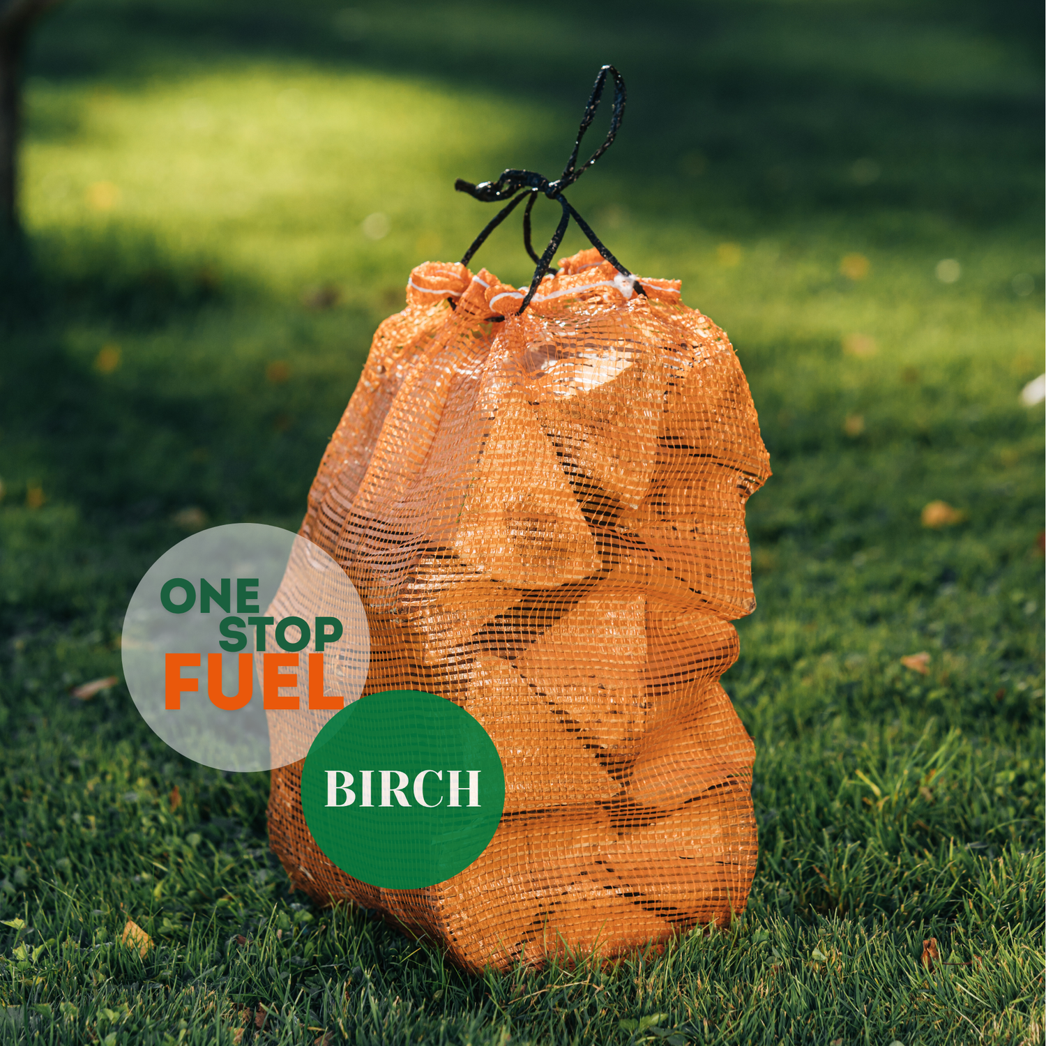 Bag of birch wood labeled 'One Stop Fuel' on a grassy background