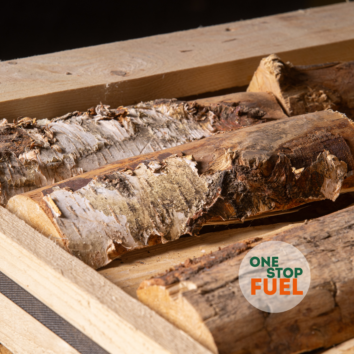 Kiln-dried birch logs in a OneStopFuel crate