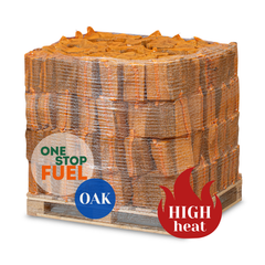 Stack of oak firewood on a pallet with branding and product features displayed.